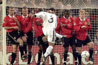 Dwight Yorke, second from right, lines up in a Manchester United wall to face a Roberto Carlos free kick in 2002. Getty