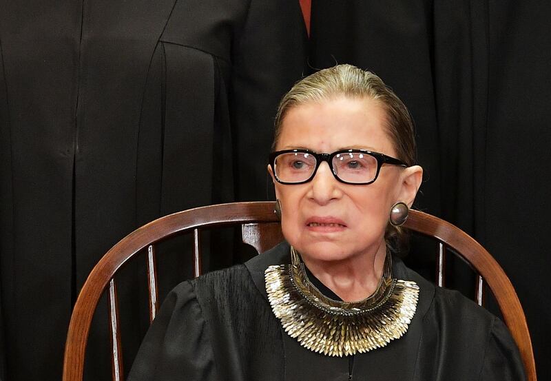 (FILES) In this file photo taken on November 30, 2018 Associate Justice Ruth Bader Ginsburg poses for the official photo at the Supreme Court in Washington, DC.  Progressive icon and doyenne of the US Supreme Court, Ruth Bader Ginsburg, has died at the age of 87 after a battle with pancreatic cancer, the court announced on September 18, 2020. Ginsburg, affectionately known as the Notorious RBG, passed away "this evening surrounded by her family at her home in Washington, DC," the court said in a statement. / AFP / MANDEL NGAN
