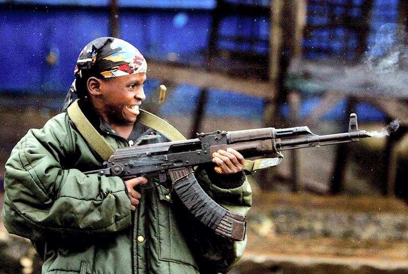 epa03197286 (FILE) A file photograph dated 28 July 2003 shows a nine year old Liberian child soldier fighting for Charles Taylor's government forces during the civil war in Monrovia, Liberia. Media reports state that Charles Taylor on 26 April 2012 became the first former African head of state to be convicted by a UN court after he was found guilty in The Hague, Netherlands,  of 11 charges of war crimes and crimes against humanity committed in Sierra Leone, including terror, murder, rape, and conscripting child soldiers. While the court found it could not prove that Taylor did have direct command over rebel operations, presiding judge Richard Lussick said the court had 'found unanimously that Mr Taylor aided and abetted RUF and AFRC rebels in the commission of war crimes and crimes against humanity in Sierra Leone.' The crimes for which he was prosecuted date from November 1996 until the official end of the war, in January 2002.  EPA/NIC BOTHMA *** Local Caption *** 50315639
