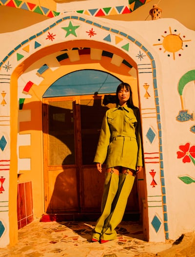 Model Mei poses outside a hand painted Nubian home. Photo: Noemi Otillia Szabo