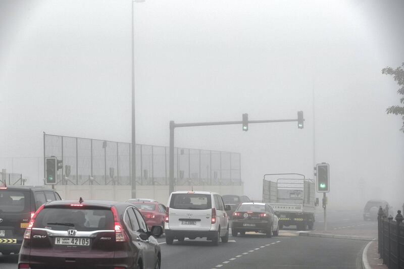 DUBAI, UNITED ARAB EMIRATES. 24 DECEMBER 2017. Heavy morning fog envelopes the city. Early morning traffic in the fog around The Springs. (Photo: Antonie Robertson/The National) Journalist: None. Section: National.