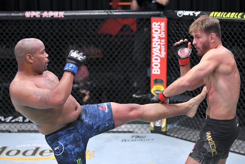 LAS VEGAS, NEVADA - AUGUST 15: (L-R) Daniel Cormier kicks Stipe Miocic in their UFC heavyweight championship bout during the UFC 252 event at UFC APEX on August 15, 2020 in Las Vegas, Nevada. (Photo by Jeff Bottari/Zuffa LLC)