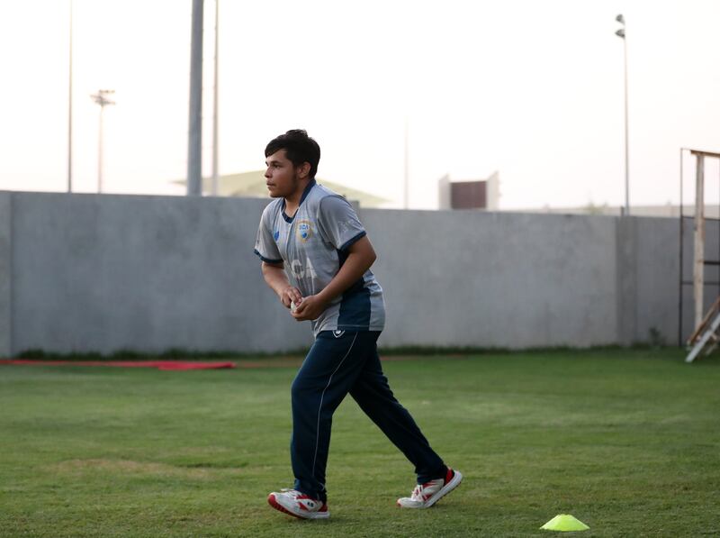 Hikmat Khan, aged 14, from Kabul with the ball in hand.
