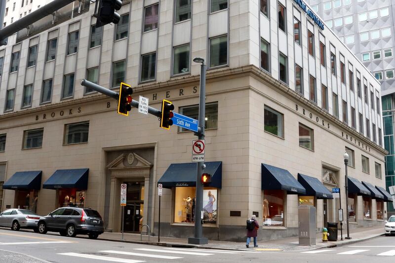 FILE - This May 6, 2020, file photo shows a Brooks Brothers store in Pittsburgh. The fashion retailer Brooks Brothers is filing for bankruptcy protection. The company that says it's put 40 U.S. presidents in its suits survived a pair of world wars and navigated through casual Fridays and a loosening of dress standards even on Wall Street, but the coronavirus pandemic pushed the 200-year-old company into seek Chapter 11 protection Wednesday, July 8, 2020.  (AP Photo/Gene J. Puskar, File)