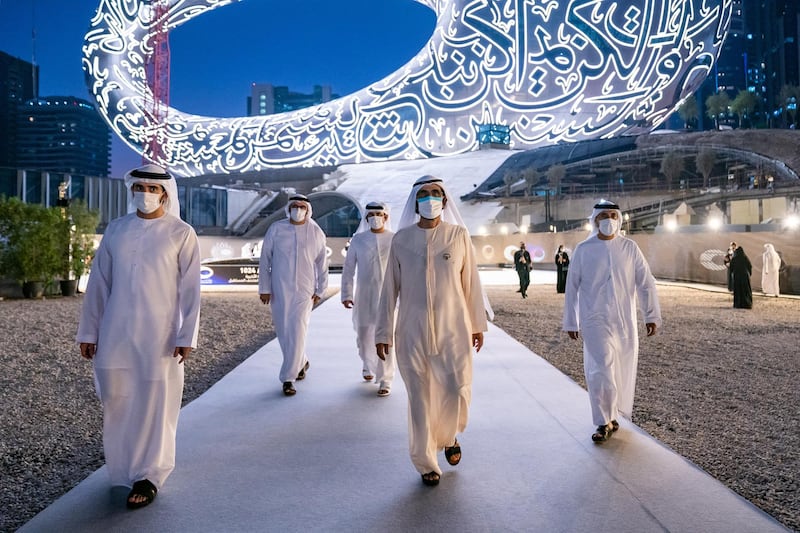 Sheikh Mohammed Bin Rashid, Vice-President and Prime Minister of the UAE and Ruler of Dubai, witnesses the installation of the final piece of façade of Museum of the Future. Seen with Sheikh Hamdan bin Mohammed bin Rashid Al Maktoum, Dubai Crown Prince and Chairman of The Executive Council of Dubai and Chairman of the Board of Trustees of Dubai Future Foundation; and Sheikh Maktoum bin Mohammed bin Rashid Al Maktoum, Deputy Ruler of Dubai. Seen with Mohammad bin Abdullah Al Gergawi, Cabinet Member, Minister of Cabinet Affairs, and Vice Chairman of the Board of Trustees of Dubai Future Foundation and Sheikh Maktoum bin Mohammed bin Rashid Al Maktoum, Deputy Ruler of Dubai. Sheikh Mohammed was accompanied during his tour of the museum by HH Sheikh Hamdan bin Mohammed bin Rashid Al Maktoum, Dubai Crown Prince and Chairman of The Executive Council of Dubai and Chairman of the Board of Trustees of Dubai Future Foundation; HH Sheikh Maktoum bin Mohammed bin Rashid Al Maktoum, Deputy Ruler of Dubai; and Mohammad bin Abdullah Al Gergawi, Cabinet Member, Minister of Cabinet Affairs, and Vice Chairman of the Board of Trustees of Dubai Future Foundation. Courtesy Museum of the Future