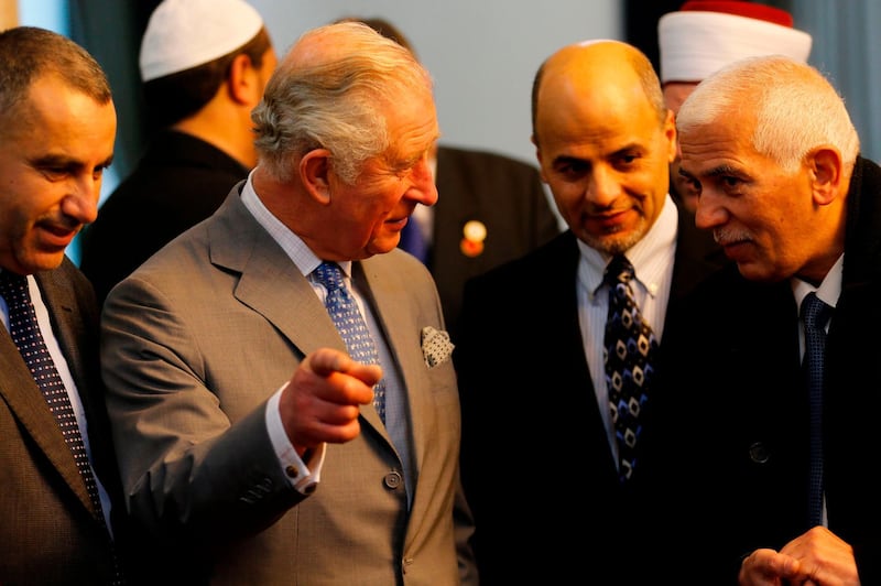 Prince Charles speaks with Muslim clerics during his visit to Omar mosque. AFP