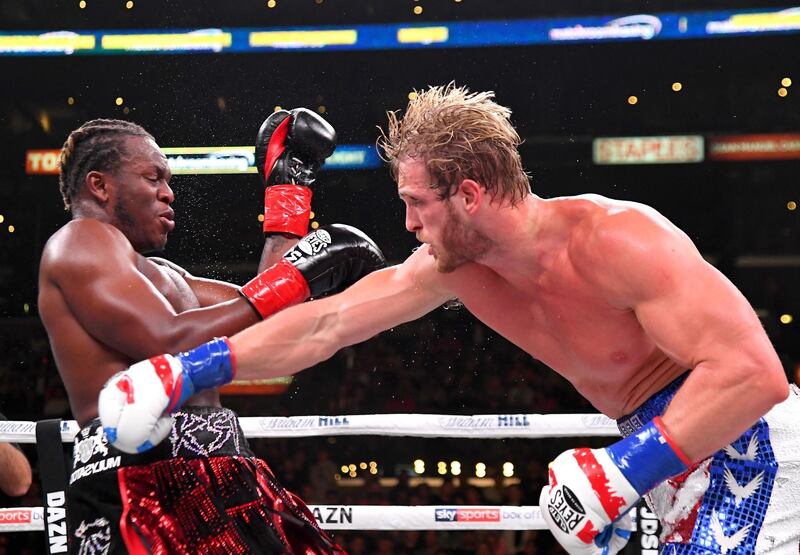 Logan Paul, right, takes a swing at KSI. Getty