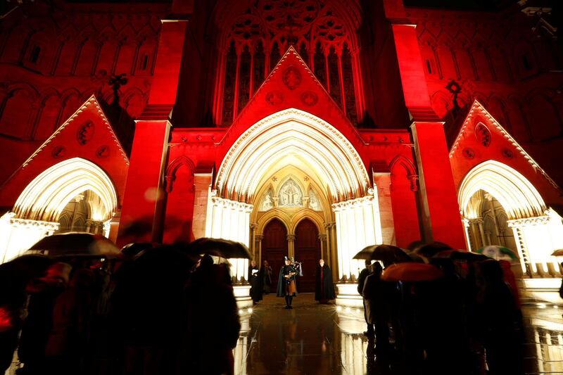 A piper plays 'When the Battle's O'er', a traditional Scottish war lament, outside St Albans Cathedral, UK. Reuters