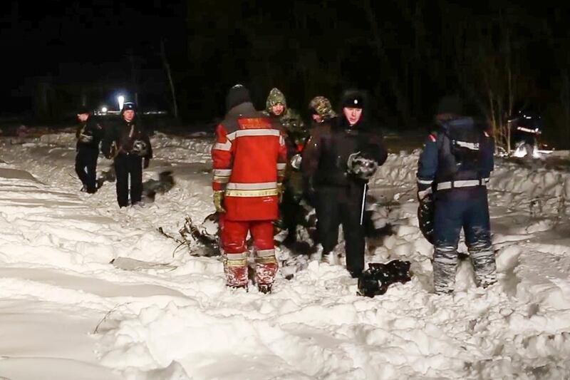 RMES employees and Russian police officers work at the scene of a AN-148 plane crash in Stepanovskoye village, about 40 kilometres from the Domodedovo airport, Russia. Russian Ministry for Emergency Situations photo via AP