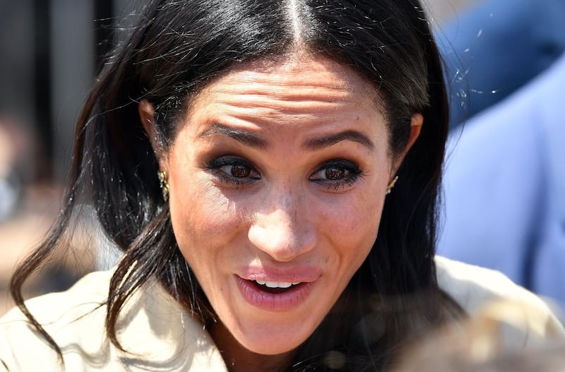 Meghan smiles as she meets with people outside the Sydney Opera House. AFP
