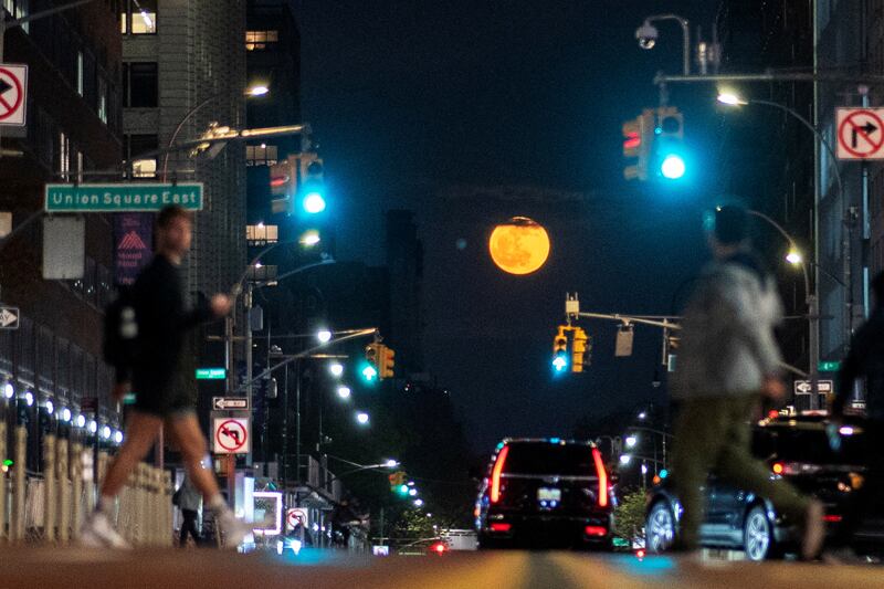 The full Flower Moon as seen along 14th in New York City in New York on May 5, 2023. Reuters