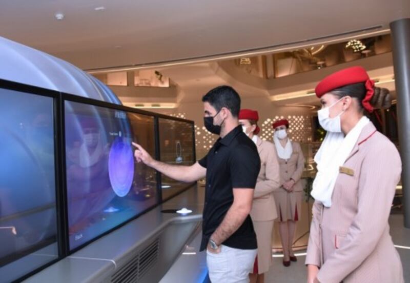 Arteta interats with an one of the pavilion's installation.