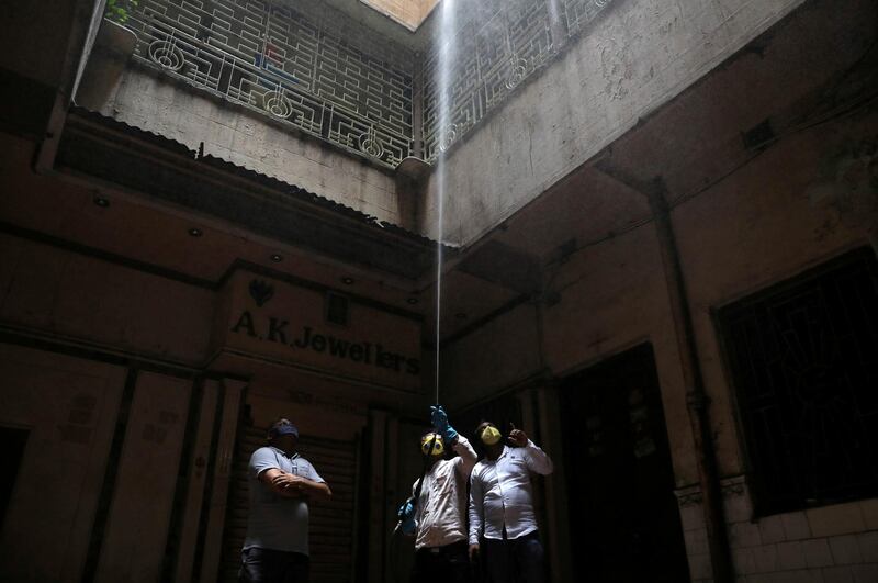 Municipal workers decontaminate a market area during an extended nationwide lockdown to slow the spreading of coronavirus disease (COVID-19) in Kolkata, India. REUTERS