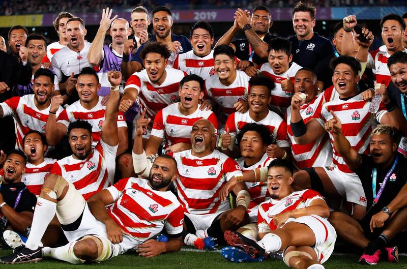 Japan's players celebrate after beating Scotland in the Rugby World Cup in Yokohama on Sunday, October 13, 2019. Victory clinched the hos nation a spot in the quarter-finals AFP