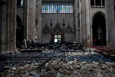 This general view shows debris inside the Notre-Dame-de Paris Cathedral in Paris on April 16, 2019, a day after a fire that devastated the building in the centre of the French capital.  French President Emmanuel Macron vowed on April 16 to rebuild Notre-Dame cathedral "within five years", after a fire which caused major damage to the 850-year-old Paris landmark. / AFP / Amaury BLIN
