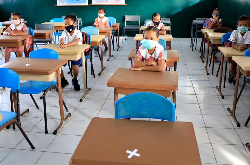 epa08515450 Students wearing protective face masks during a class at a reopened school amid an easing of coronavirus restrictions in Dili, Timor Leste, also known as East Timor, 29 June 2020. The government reopened some qualified schools with cover-19 protocol.  EPA/ANTONIO DASIPARU