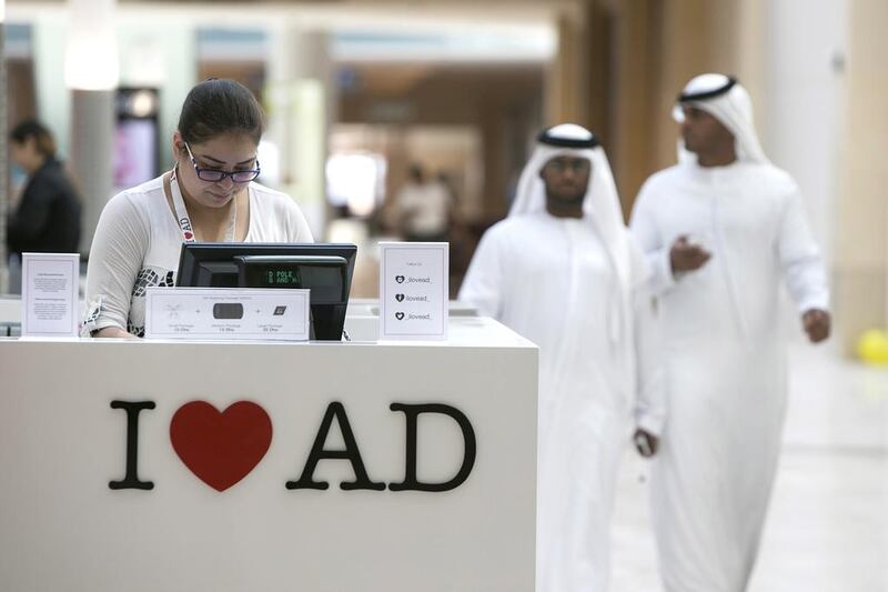 People browse at the newly opened Yas Mall. The mall covers 235,000 square metres with 400 shops covering 370 brands. Silvia Razgova / The National