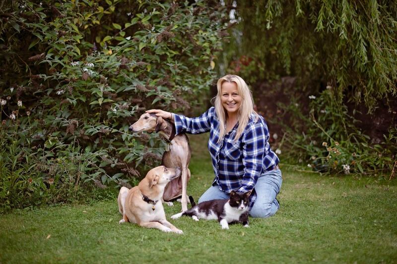 Sarah Laidlaw with her three rescue animals at home in Scotland after relocating from the UAE in August. Courtesy: Ewa Well