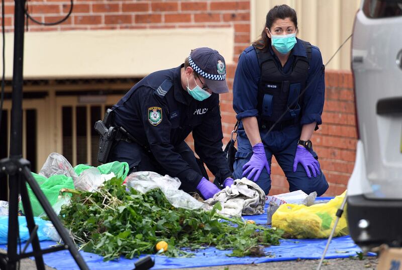 Police search for evidence at a block of flats in the Sydney suburb of Lakemba. William West.