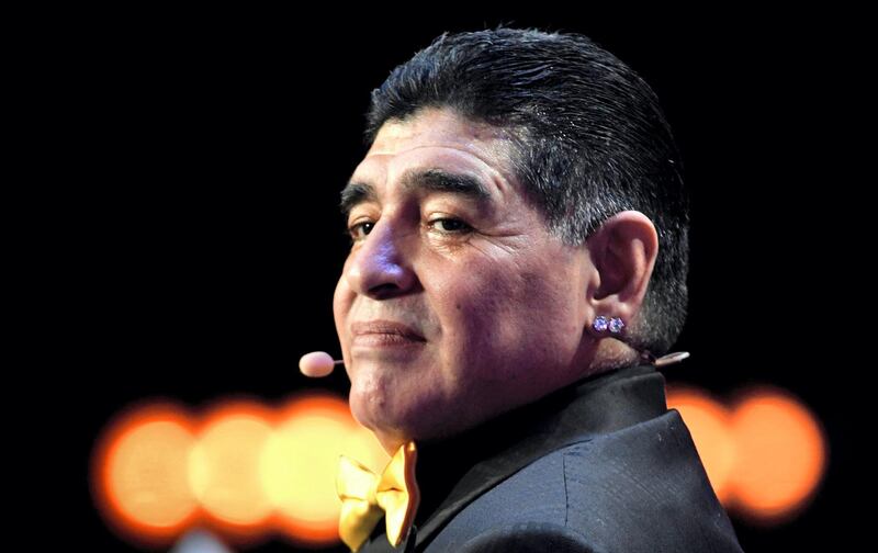 (FILES) In this file picture taken on December 1, 2017 Argentina's former footballer Diego Maradona poses on stage ahead of the 2018 FIFA World Cup football tournament final draw at the State Kremlin Palace in Moscow. Argentine football legend Diego Maradona turns 60 on October 30, 2020.   / AFP / Alexander NEMENOV
