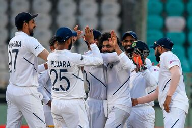 India's Ravindra Jadeja, centre, picked up the wicket of South Africa opener Dean Elgar. AFP