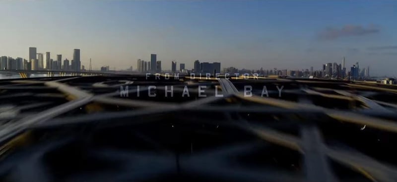 The opening credits of the '6 Underground' trailer pan over Louvre Abu Dhabi's dome, with the capital's skyline visible in the background. YouTube / Netflix