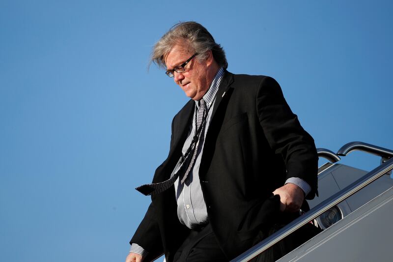 FILE - In this April 9, 2017 file photo, White House chief strategist Steve Bannon steps off Air Force One at Andrews Air Force Base, Md. Bannon, a forceful but divisive presence in President Donald Trump's White House, is leaving. Trump accepted Bannon's resignation Friday, Aug. 18, 2017, ending a turbulent seven months for his chief strategist, the latest to depart from the president's administration in turmoil.  (AP Photo/Alex Brandon, File)