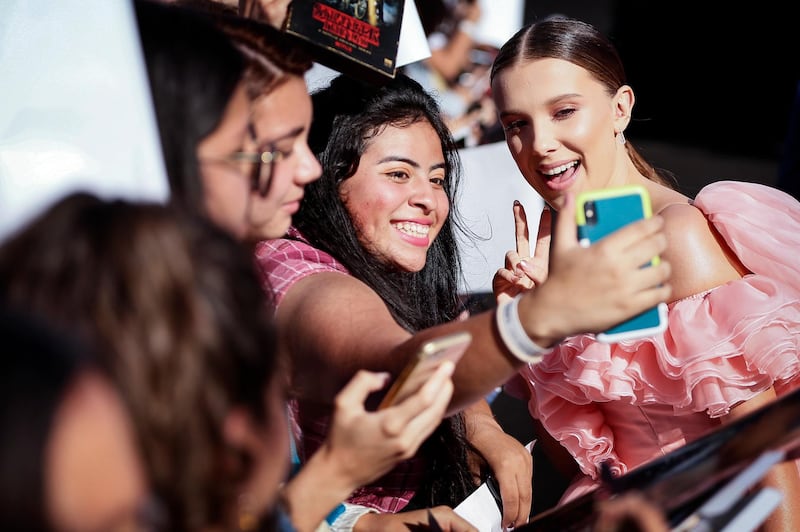 British actress Millie Bobby Brown (right) interacts with fans on the red carpet prior to the premiere of 'Stranger Things: Season 3' in Santa Monica, California.  EPA