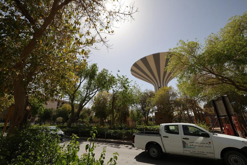 Cars drive by on a tree-lined road in the Saudi capital Riyadh, on March 29, 2021. - Although the OPEC kingpin seems an unlikely champion of clean energy, the "Saudi Green Initiative" aims to reduce emissions by generating half of its energy from renewables by 2030. (Photo by Fayez Nureldine / AFP)