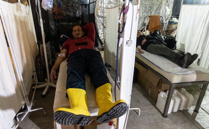 Injured at a hospital set up in a camp in Antakya. Reuters