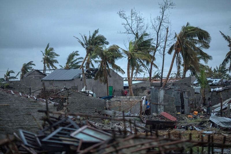 A handout photo made available by CARE, an international humanitarian agency shows local residents inspecting the damages after cyclone Idai made landfall in Sofala Province, Central Mozambique. A Category 4 Cyclone named Idai made land fall wreaking havoc knocking out power across the province and impacting every resident in Central Mozambique.  EPA