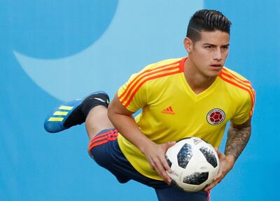 Colombia's James Rodriguez warms up during Colombia's official training on the eve of the group H match between Colombia and Japan at the 2018 soccer World Cup in the Mordavia Arena in Saransk, Russia, Monday, June 18, 2018. (AP Photo/Eugene Hoshiko)