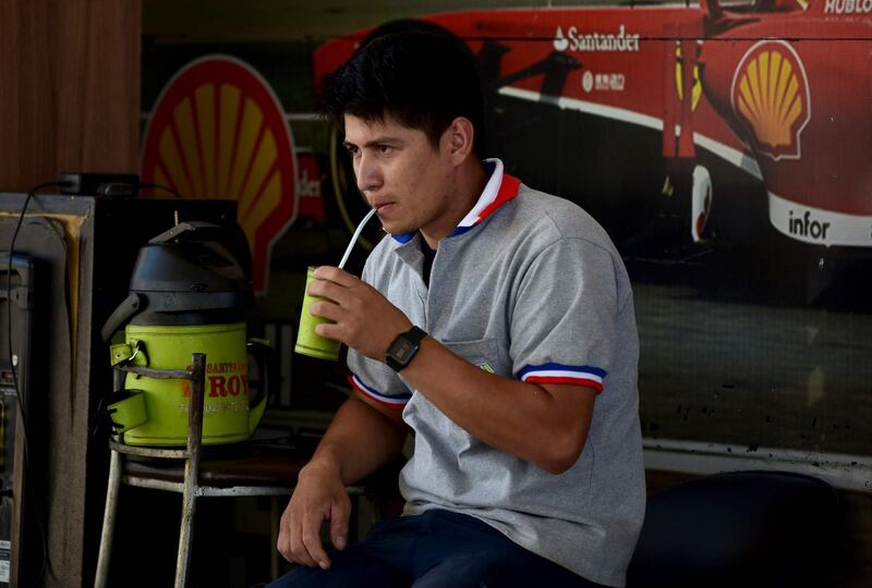 A man drinks terere, a Paraguayan infusion of yerba mate and cold water. AFP
