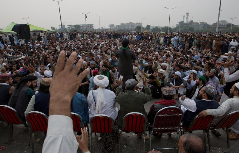 Supporters of Pakistani religious groups gather and block a main road to the capital center following a court decision in favor of a Christian woman in Islamabad, Pakistan. Christian woman Asia Bibi acquitted in Pakistan after eight years on death row for blasphemy plans to leave the country, her family said Thursday as radical Islamists mounted rallies for a second day against the verdict, blocking roads and burning tires in protest. AP Photo