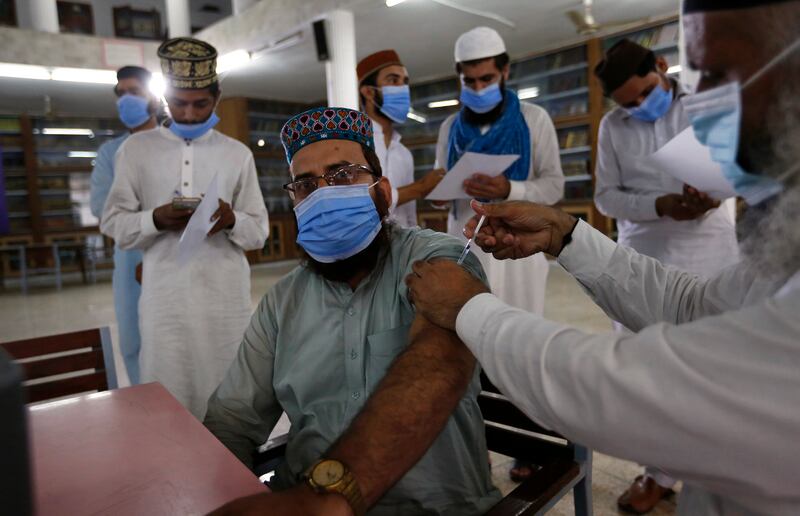 A student in Lahore receives the Convidecia vaccine, made by CanSino Biologics. Associated Press