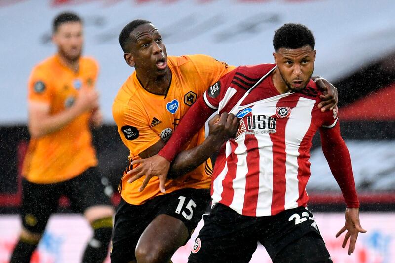 Wolverhampton Wanderers' Willy Boly, left, vies with Sheffield United's Lys Mousset. AFP