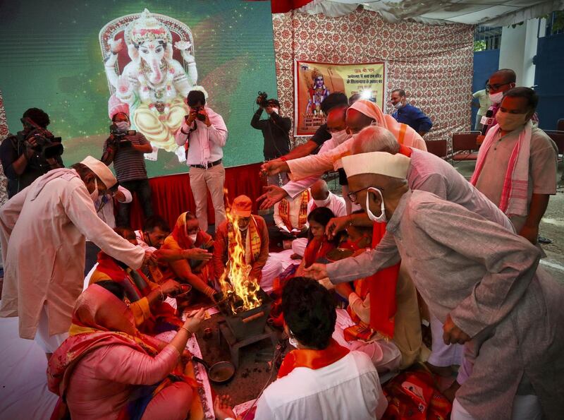 Hindus offer prayers for a groundbreaking ceremony of a temple dedicated to the Hindu god Ram in Ayodhya, at the Vishwa Hindu Parishad headquarters in New Delhi, India. AP Photo