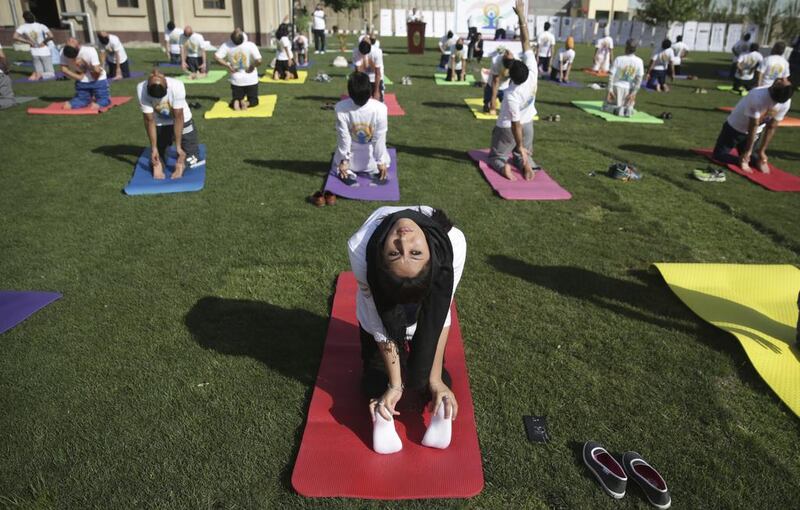 Afghans and foreigners perform yoga to mark International Yoga Day at the Indian Embassy, in Kabul, Afghanistan. Massoud Hossaini / AP photo