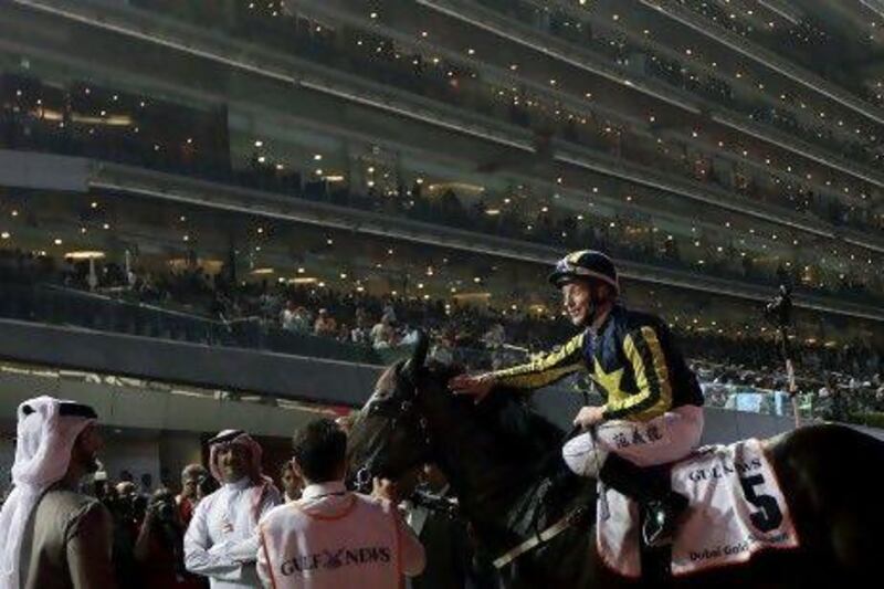 Irish jockey Kieren Fallon and Krypton Factor after winning the Dubai Golden Shaheen.