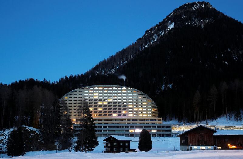 The Intercontinental Hotel is seen behind a farmhouse in Davos, Switzerland. Reuters
