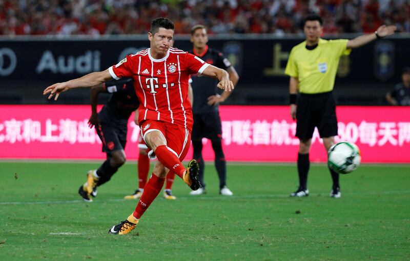 Bayern Munich's Robert Lewandowski scores his sides first goal from the penalty spot. Damir Sagolj / Reuters
