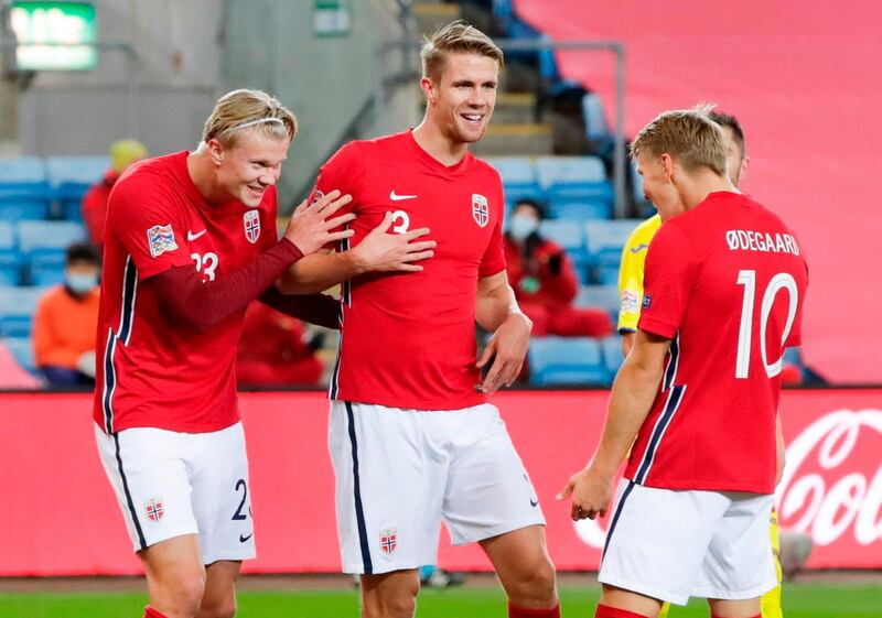 Norway's forward Erling Braut Haaland (L) clebrates scoring with Norway's defender Kristoffer Vassbakk Ajer and Norway's midfielder Martin Odegaard (R) during the UEFA Nations League football match Norway v Romania, on October 11, 2020 in Oslo, Norway. Norway OUT
 / AFP / NTB / Vidar Ruud

