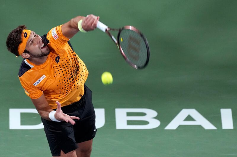 Jiri Vesely serves to Andrey Rublev during the final in Dubai. AP