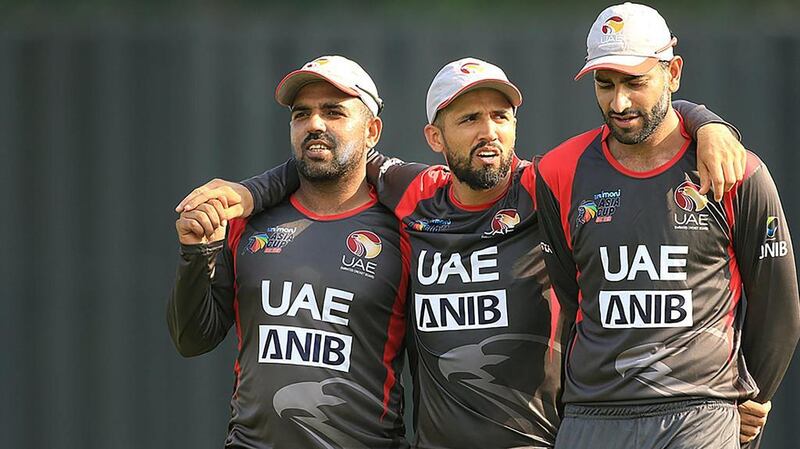 Rohan Mustafa, centre, top scored with 71 and also took two wickets in the UAE's victory over Oman. Courtesy ACC