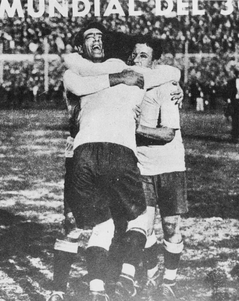 Uruguay players Lorenzo Fernandez, Pedro Cea and Hector Scarone celebrate being champions of the world. Getty Images