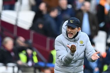 Chelsea's German head coach Thomas Tuchel gestures from the side-lines during the English Premier League football match between West Ham United and Chelsea at The London Stadium, in east London on December 4, 2021.  (Photo by Glyn KIRK / AFP) / RESTRICTED TO EDITORIAL USE.  No use with unauthorized audio, video, data, fixture lists, club/league logos or 'live' services.  Online in-match use limited to 120 images.  An additional 40 images may be used in extra time.  No video emulation.  Social media in-match use limited to 120 images.  An additional 40 images may be used in extra time.  No use in betting publications, games or single club/league/player publications.   /  