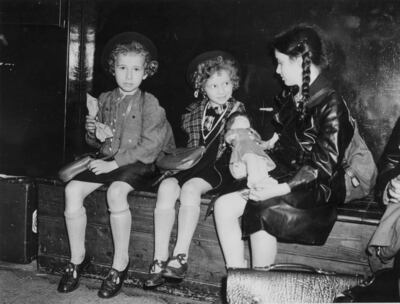 Three Jewish refugee children waiting to be collected by their sponsors at London Liverpool Street in July 1939. Getty Images