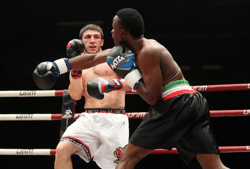 Kagimu (blue gloves) takes on Aminov (red gloves) at the Social Knockout at the Coca-Cola Arena in Dubai.