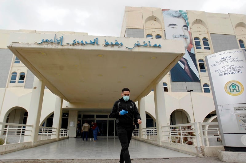 epa08284157 A man wears a face mask as he walks in front of the entrance of the Rafik Hariri University Hospital in Beirut, Lebanon, 10 March 2020. Lebanese Rafic Hariri University Hospital confirmed on 10 March its first death from coronavirus, the Health Ministry confirmed that the patient was a 56-year-old Lebanese citizen who traveled via airplane from Egypt to Lebanon on 20 February 2020. Lebanon on 10 March saw the largest one-day increase since the first case of coronavirus in Lebanon was announced on 21 February, with eleven new cases confirmed. Lebanon has now confirmed a total of 52 cases, with four in a critical state in the Rafik Hariri University Hospital.  EPA/WAEL HAMZEH