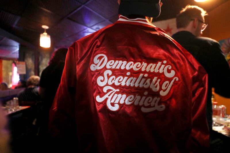 An attendee wears a jacket at an Iowa caucus watch party with supporters of Democratic presidential candidate Bernie Sanders organised by Metro D.C. Democratic Socialists of America in Washington, DC. AFP